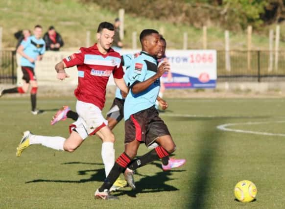 Jack McLean (maroon shirt) tracks back during Hastings United's 1-1 draw at home to Sittingbourne. Picture courtesy Joe Knight