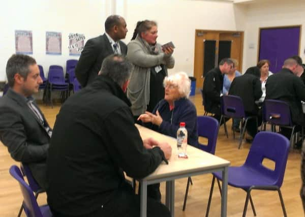 Shoreham Beach councillor Liza McKinney questions Jonathan Candelon, managing director at Brighton City Airport, left