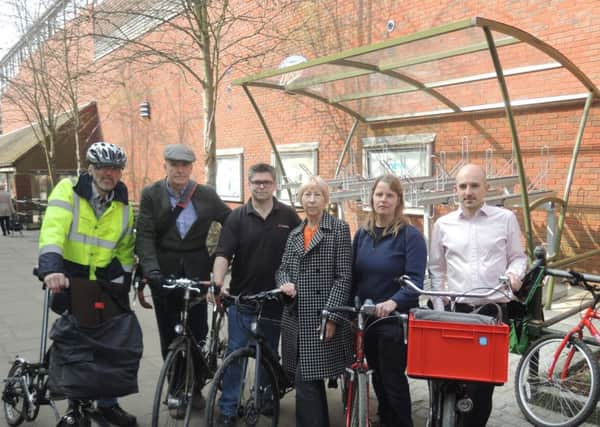 David Algar, Greg Collins, Nik Butler, Morwen Millson, Ruth Fletcher and Mark Treasure in Medwin Walk in front of new Horsham District Council cycle parking shelter (Johnston Press/JJP). SUS-150904-103843001