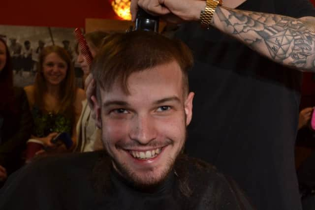 . Reporter James Oxenham during shave. SUS-150414-104935001