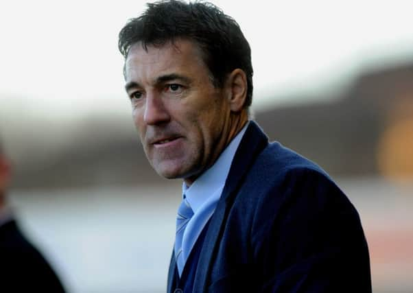 Dean Saunders the new Crawley Town manager watches his side against Colchester (Pic by Jon Rigby) PPP-141228-185117004