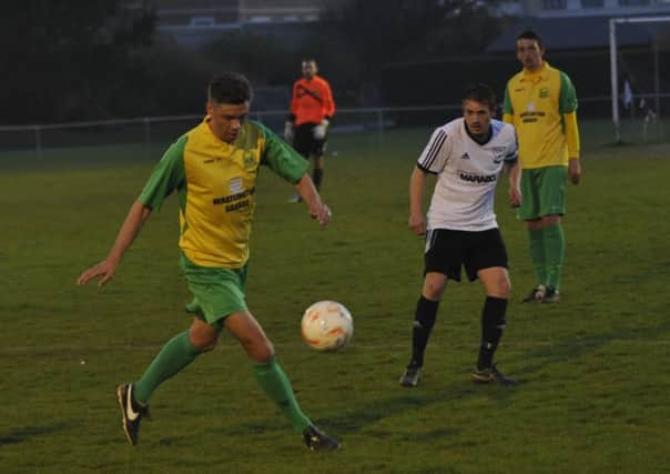 Action from Bexhill United's victory over Westfield in the Hastings & District FA Senior Cup final. Picture by Simon Newstead (SUS-151104-001105002)