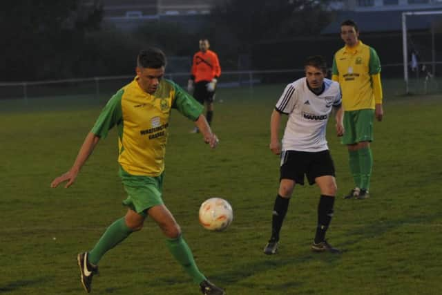 Action from Bexhill United's victory over Westfield in the Hastings & District FA Senior Cup final. Picture by Simon Newstead (SUS-151104-001105002)