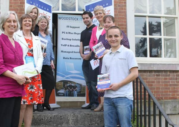 A group shot of the exhibitors and 2015 prize winners with Horsham District Council Economic Development Manager Chris Baister SUS-150421-121744001