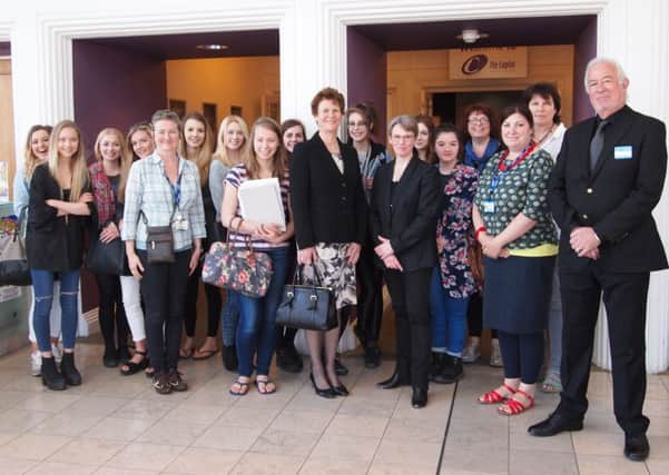 Sally Bromley and Linda Smith (centre) with John Stewart (right) and Collyers students and staff SUS-150427-153027001