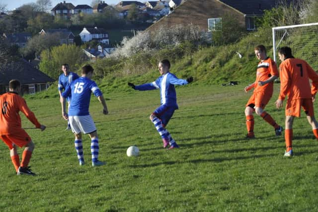 Action from JC Tackleway II's victory over AFC St Leonards on Wednesday, last week. Picture by Simon Newstead (SUS-150422-214552002)