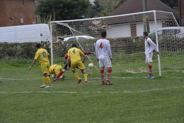 Bexhill AAC score their second goal in the 3-1 win away to Mountfield United. Picture by Simon Newstead (SUS-150205-200046002)