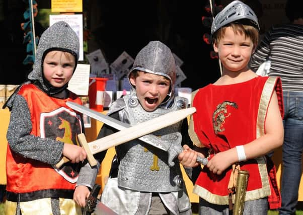 Battle of Hastings at Battle Abbey.
10.10.10.
Picture by: TONY COOMBES PHOTOGRAPHY.
Saxon soldier Leo Carroll (centre) being held by 2 Norman warriors Edward Geering and Johnny Newman
BH42705k