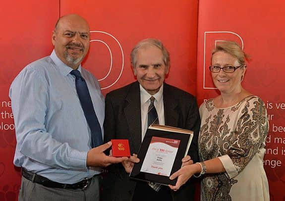 Brian Hooker, centre, with guest speakers Richard Baldwin and Claire Baldwin