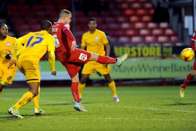 Lee Fowler scores the all important winner for Crawley Town against Preston North End (Pic by Jon & Joe Rigby) PPP-150302-090507004