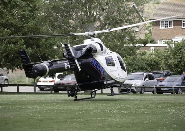 The air ambulance lands near to the house. PHOTO: Ashley Woods SUS-150525-131237001