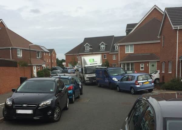 Parking problems on Bostock Road in Chichester, where new parking restrictions are planned