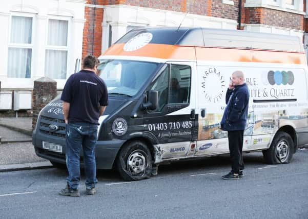 Van owner inspects the damage to his vehicle   PHOTO: Eddie Mitchell SUS-151106-102622001