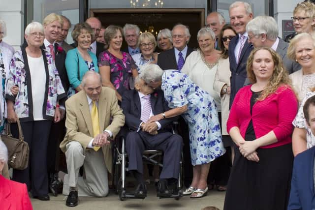 The newlyweds surrounded by friends and family. Picture by Paul James SUS-150615-133506001