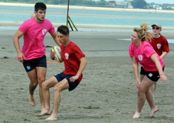 A team member from Chichester High School with the ball / Picture by Kate Shemilt