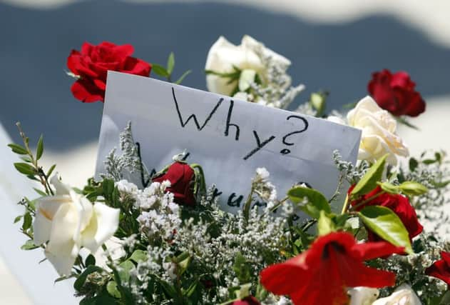 Flowers at the scene of the massacre in Sousse as sources warned the British death toll could rise to at least 30 (PA) SUS-150207-101854001