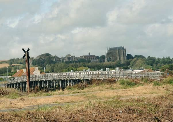 The Downs Link opposite the Red Lion pub, with views of the Old Tollbridge and Lancing Colleges chapel