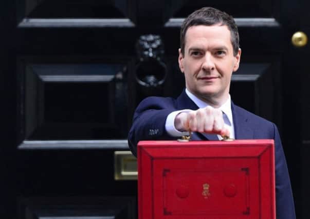 Chancellor of the Exchequer George Osborne outside 11 Downing Street, London, before heading to the House of Commons to deliver his annual Budget statement. PRESS ASSOCIATION