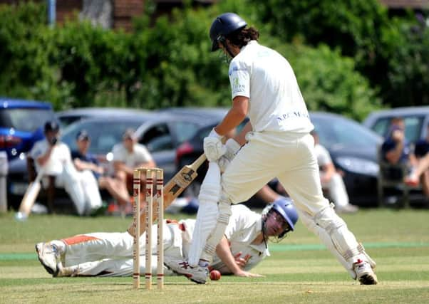 Portslade batsman Danny Hansen makes his ground despite the efforts of Steynings Ed Lamb on Saturday SR1517089 				    PICTURE BY STEVE ROBARDS