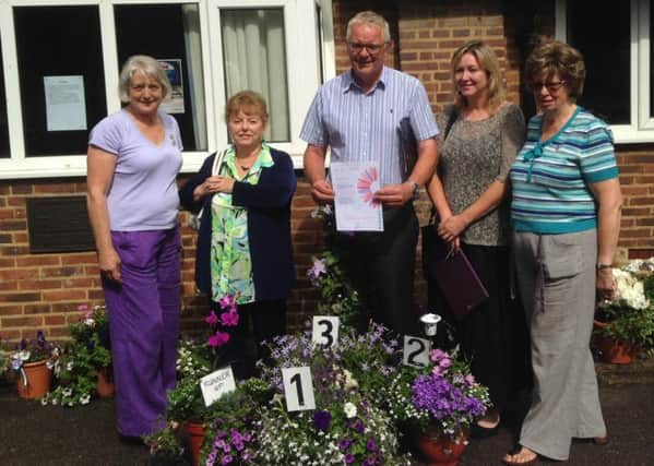 From left, prize winners Jenny Blake and Su Carter, judges Chris Evans and Linda Ball, and  Brenda Wall with the winning pots