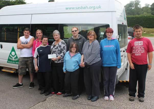 Faiza Shafeek from Johnston Press with some of the SASBAH service users