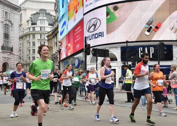 Horsham father Simon Perry who has challenged himself to run 1,000km in 2015 for the international water aid charity Just a Drop - picture submitted