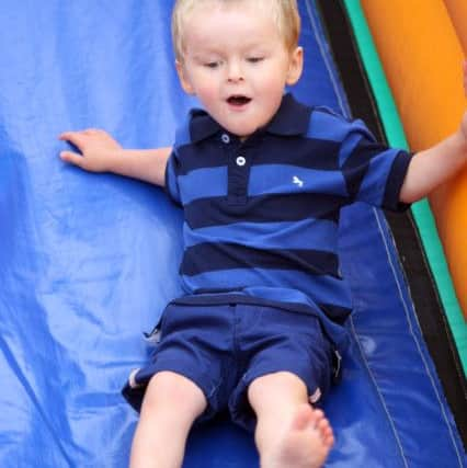 Three-year-old Harrison Wood on the slide DM151813a