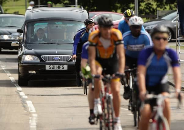 Procession of cyclists, including members of the Worthing Excelsior Cycling Club, accompany the coffin of great-grandfather Don Lock ahead of his funeral at Worthing Crematorium. PRESS ASSOCIATION Photo. Issue date: Wednesday August 12, 2015. Lock, a keen cyclist, was stabbed to death in an alleged road rage attack following a collision involving his car and another vehicle on the A24 at Findon, near Worthing, West Sussex, on July 16. See PA story FUNERAL Lock. Photo credit should read: Yui Mok/PA Wire FUNERAL_Lock_150456.JPG