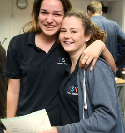 DM153333a.jpg A level results, Steyning Grammar School. Amber Merahie left and Charlotte Mulvaney. Photo by Derek Martin SUS-150813-211145008