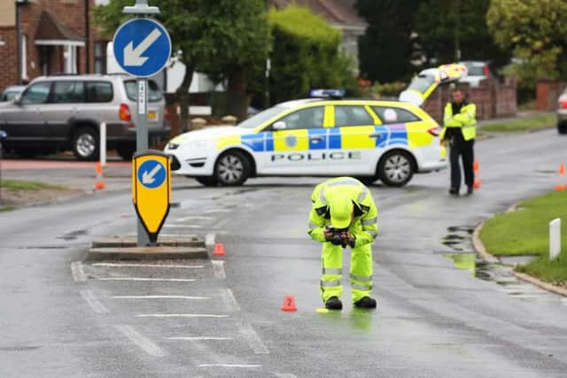 Police working at the scene of the crash in Abbey Road, Sompting.  PICTURE BY EDDIE MITCHELL SUS-150819-183122001