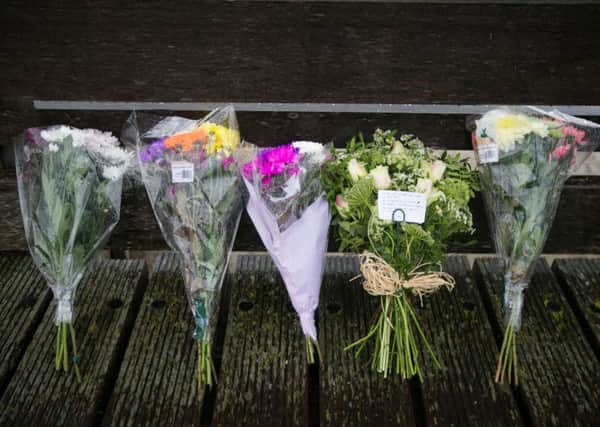 Flowers laid on the Shoreham Tollbridge that crosses the River Adur near the site where seven people died when an historic Hawker Hunter fighter jet plummeted on to the A27 at Shoreham in West Sussex after failing to pull out of a loop manoeuvre. PRESS ASSOCIATION Photo. Picture date: Sunday August 23, 2015. More bodies may be found as investigators and emergency services continue to search the scene of the Shoreham Airshow plane crash, police said. Photo: Daniel Leal-Olivas/PA Wire