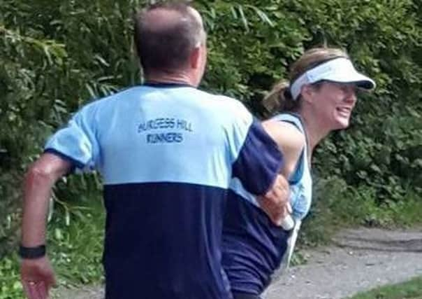 Karen wrestles the River Relay baton from Steve (courtesy: Helen Pratt) wGDxvreJRHDTLc6Wbg-h