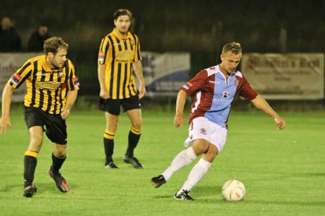 Sam Adams on the ball for Hastings United in the reverse fixture against Folkestone Invicta two weeks ago. Picture courtesy Joe Knight