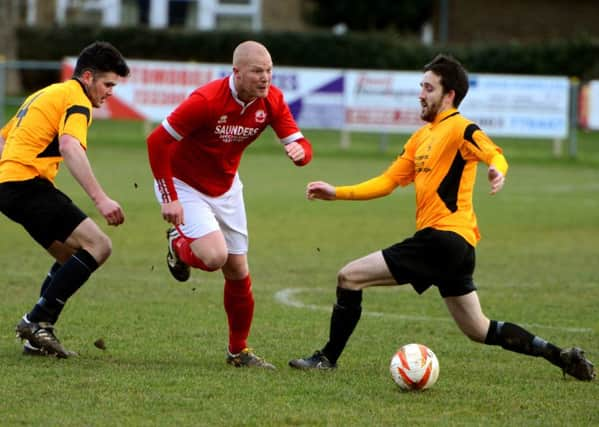 Scott Tipper (centre) hit a hat-trick for Arundel at Mile Oak on Wednesday