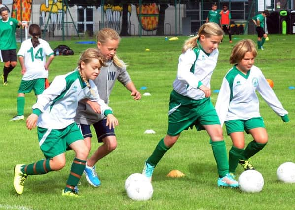 Girls just wanna have fun - and that's exactly what they did at the football open day at Chi College / Pictures by Kate Shemilt