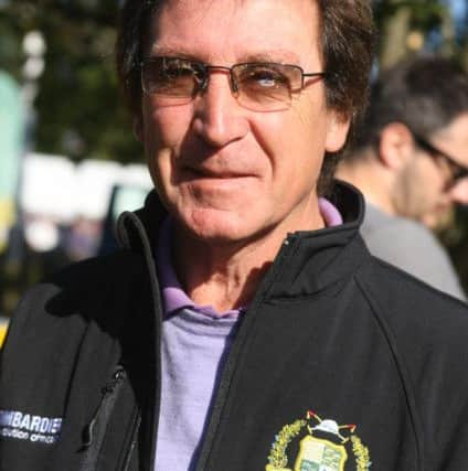 DM151178102a.jpg Barns Green Half Marathon, 2015. Kenny Jones who started the race. Photo by Derek Martin SUS-150927-155207008