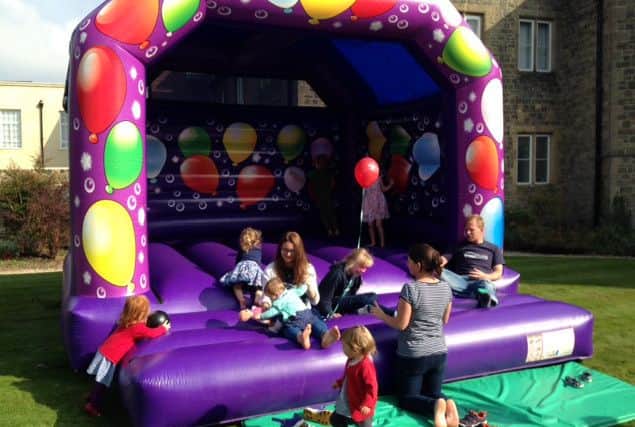 Children having fun on the bouncy castle