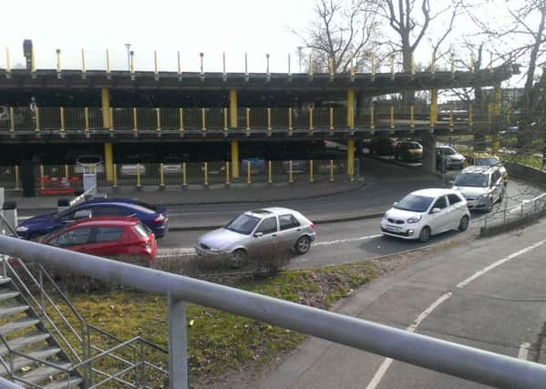 Traffic building up waiting to exit Avenue De Chartres car park SUS-150603-102851001