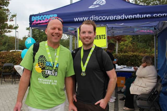 First to cross the finish line, Andy Burt, left, ands econd walker back, Chris Walsh