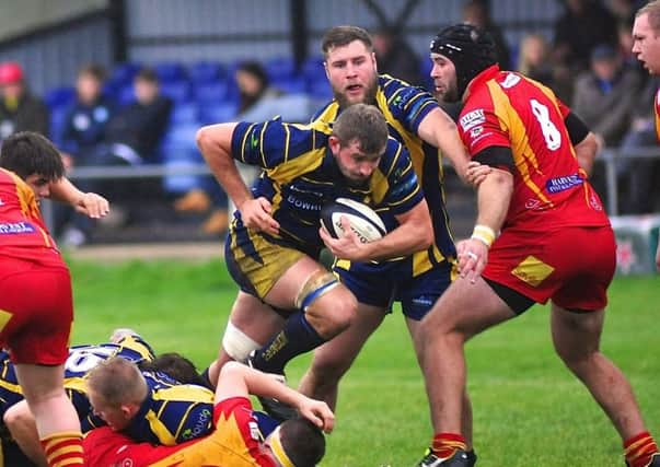 Worthing Raiders Liam Perkins charges forward against Cambridge on Saturday (above). Below, action from the game.			 							     PICTURES BY STEPHEN GOODGER