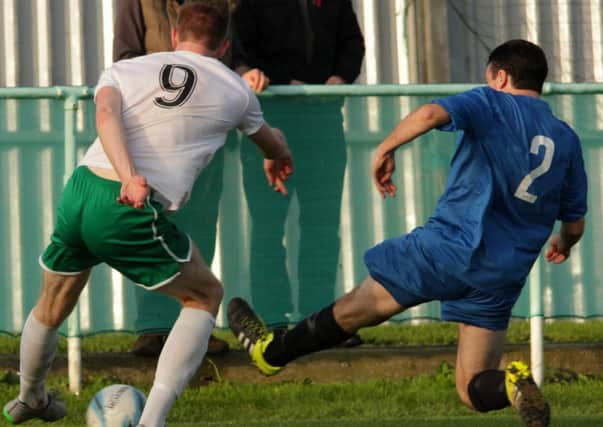 Jimmy Wild gets a cross in during City's win over Horsham YMCA / Picture by Chris Hatton