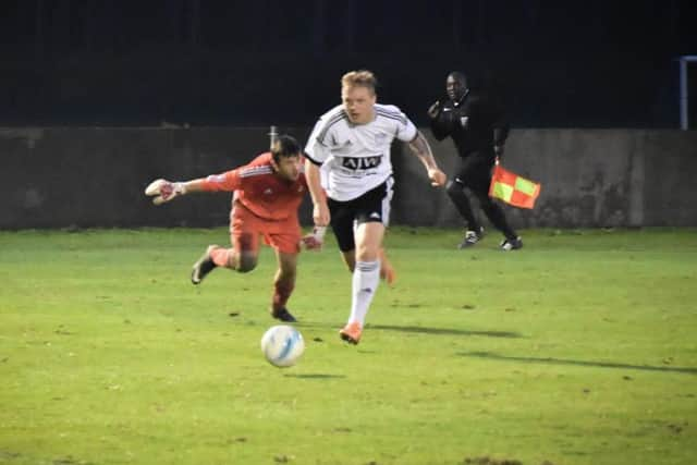 Loxwood's Charlie Pitcher scoring their third against Highmoor Ibis