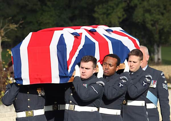 The remains of the crew of Lancaster ED427 are carried to their final resting place in the Commonwealth War Grave Cemetery at Durnbach.     Picture by Mike Drewett