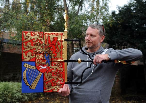 Peter Roberts with the weather vane. KS1500560-1 SUS-150311-181954008