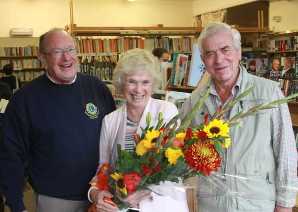 Lion Chris Davis and LIon President Ken Johnson outside the bookshop SUS-150911-154146001