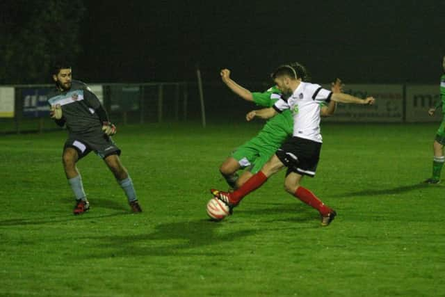 Nick Sullivan (white) in action scored a brace for Horsham YMCA