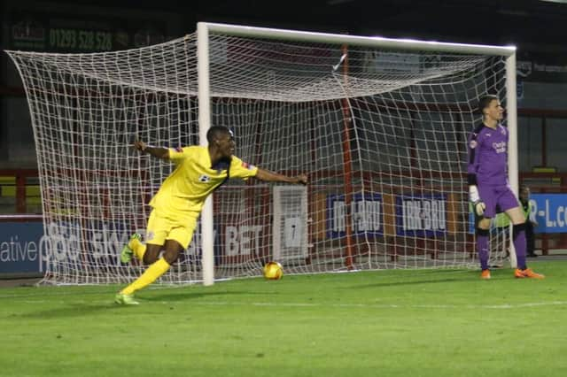 Bright Temba wheels away in celebration after scoring Hastings United's equaliser against Crawley Town. Picture courtesy Joe Knight