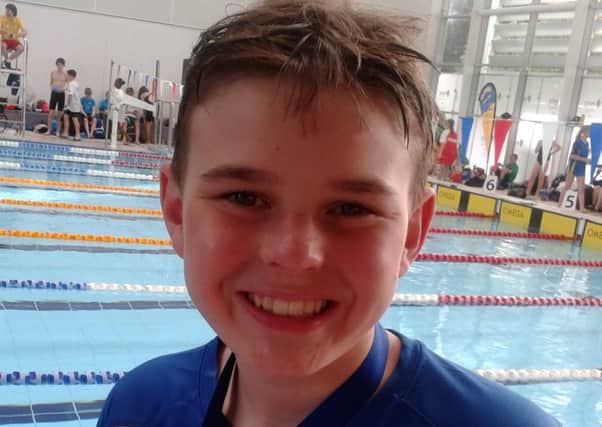 Archie Strowger with one of his medals