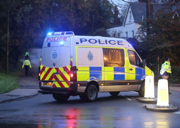 Police at the scene of the fatal crash near Cowfold.