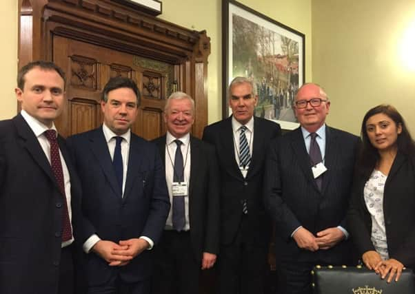 Horsham MP Jeremy Quin with fellow Sussex MPs Tom Tugendhat and Nus Ghani, Gatwick Airport chairman Sir Roy McNulty and members of the Independent Commission on Arrivals.